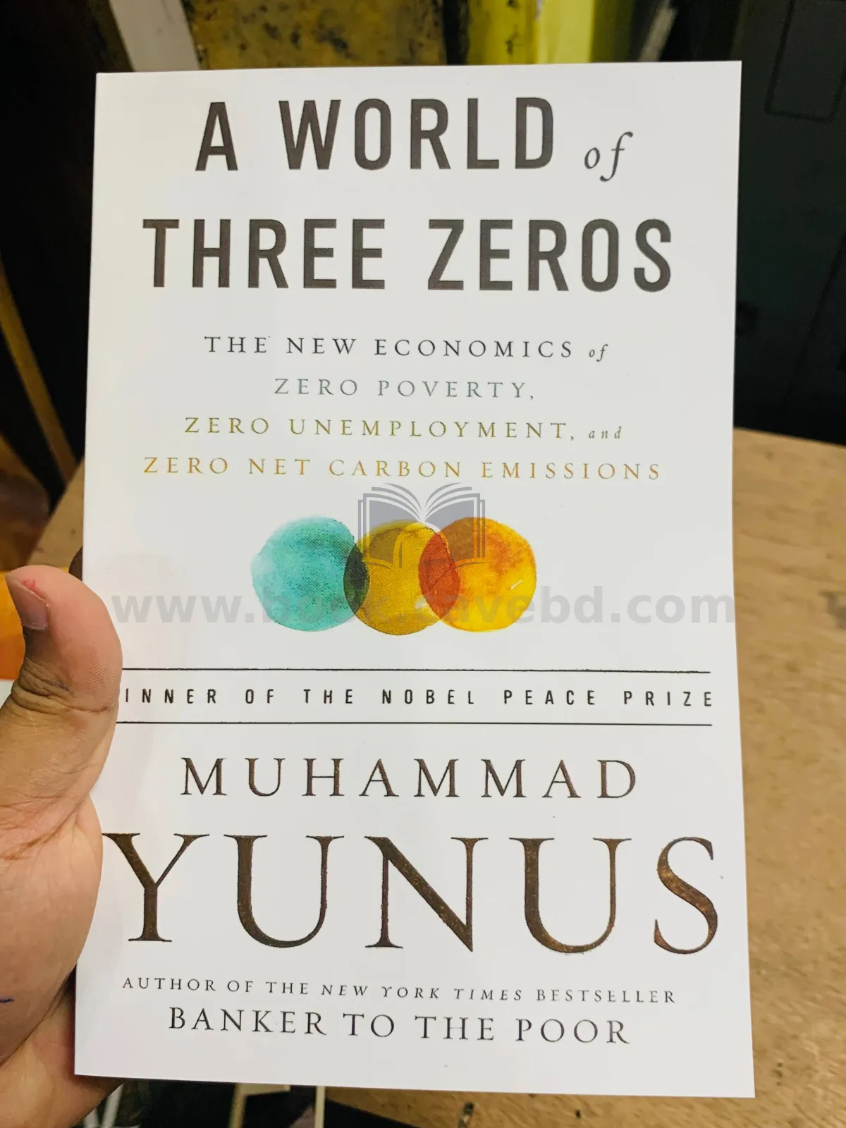 A World of Three Zeros: The New Economics of Zero Poverty, Zero Unemployment, and Zero Net Carbon Emissions